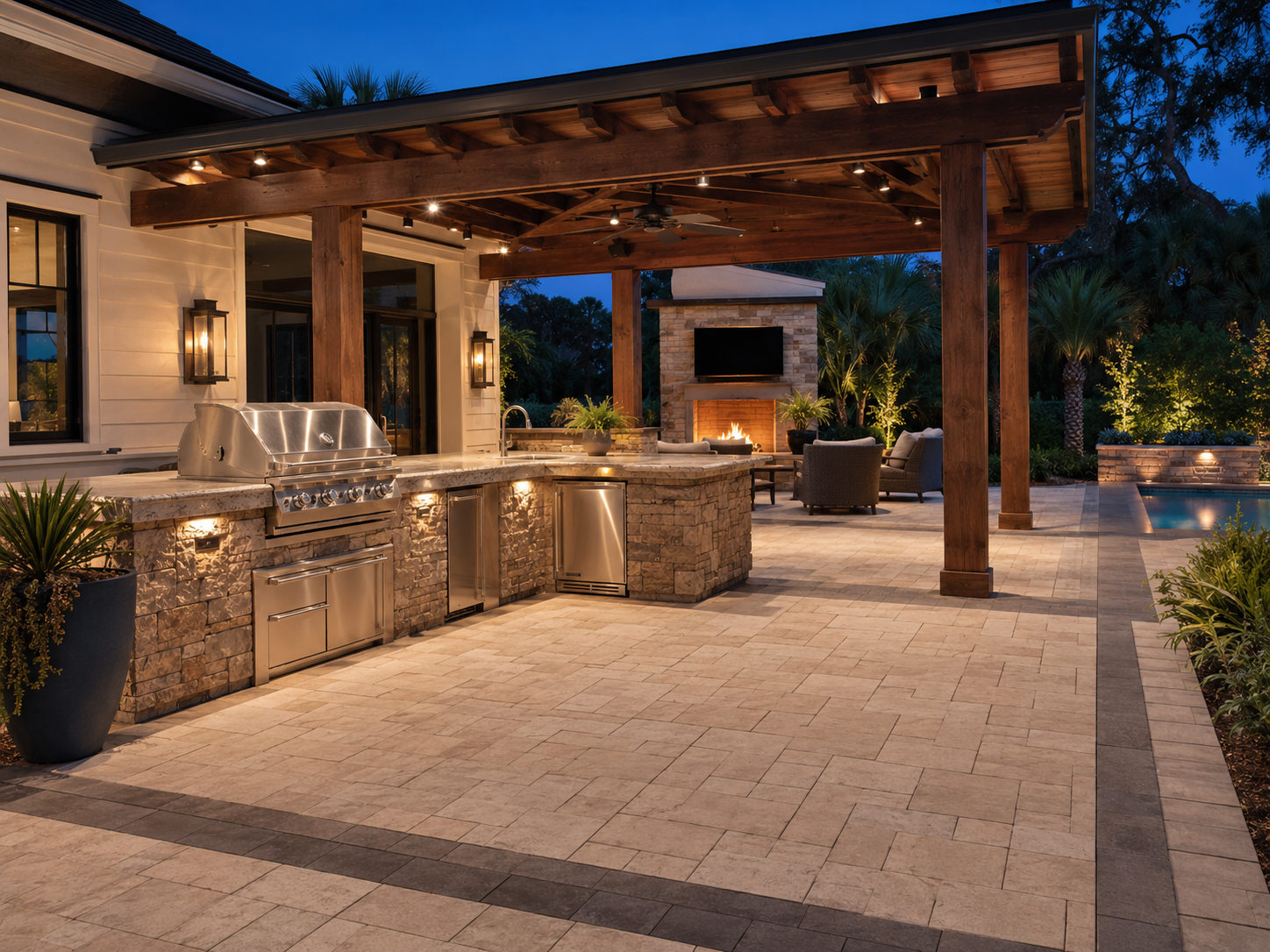 Luxury outdoor kitchen integrated with a finished paver patio